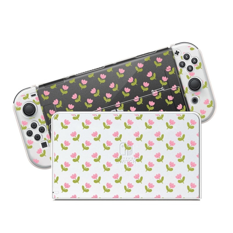 For the cozygamer seeking a dream console, the Pink Tulips Case for Nintendo Switch by petimint is a perfect match. The front docking station features a white background embellished with delicate pink tulips, while the backside of the handheld controller showcases a sleek black background adorned with matching blooms. The joysticks and buttons are seamlessly integrated to ensure an engaging gaming experience.