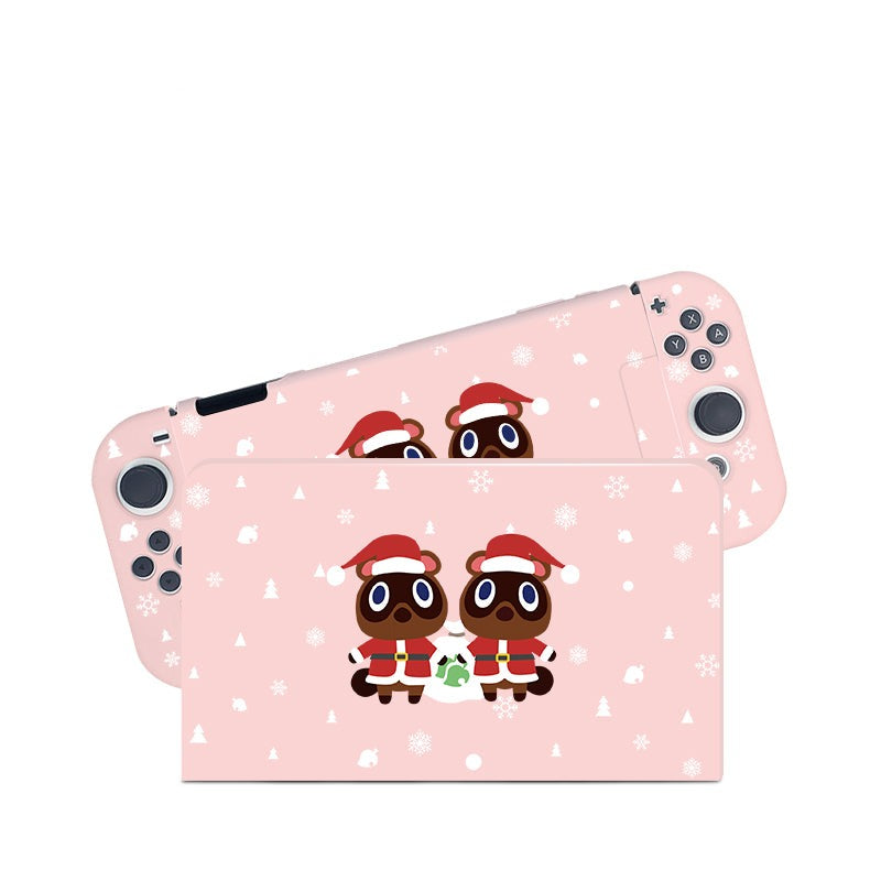 The Timmy & Tommy Christmas Case for Nintendo Switch by petimint is pink and features a festive holiday design with two cartoon raccoons wearing red Santa hats and holding a green gift. The background showcases white snowflakes and small, simple icons of holiday-themed items.